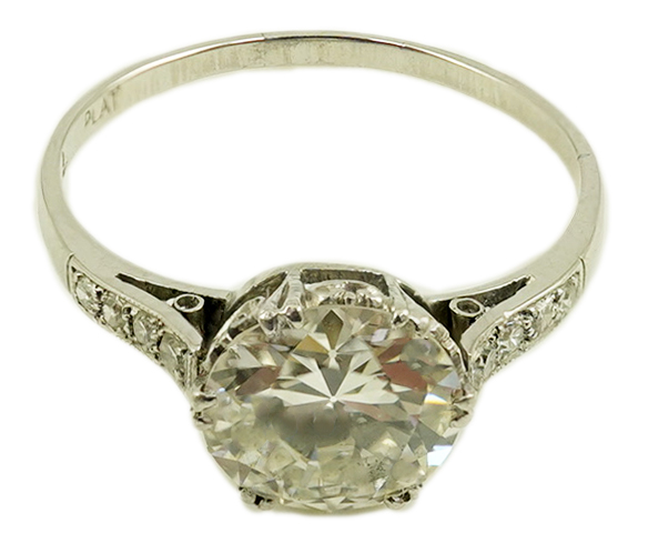 A platinum and single stone diamond set ring, with graduated eight stone diamond chip set shoulders, with a Mappin & Webb probate valuation dated 01/06/2024